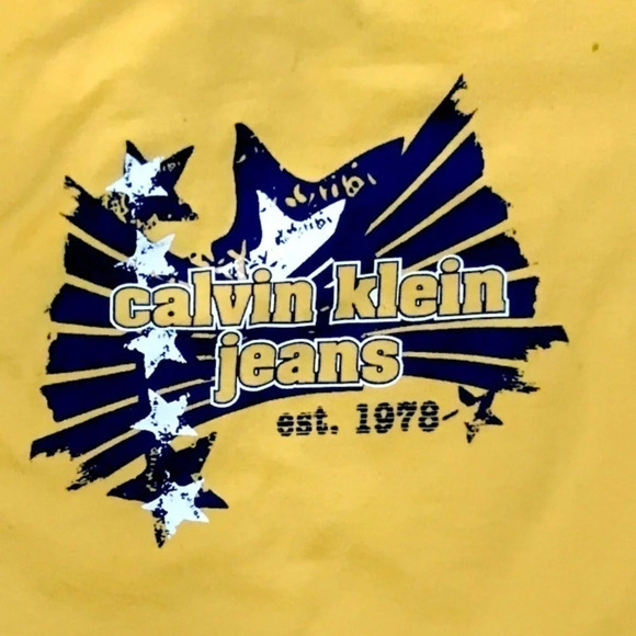 4/$20🥳 Yellow  Calvin Klein Jeans Shirt - Picture 2 of 4